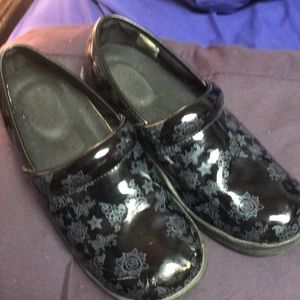 Woman’s black clog